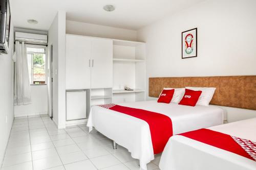 Postel nebo postele na pokoji v ubytování OYO Praia Hotel Recanto do Tomé - Salvador