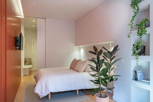 Ένα ή περισσότερα κρεβάτια σε δωμάτιο στο C3 Alojamiento moderno junto a la Catedral, Santander