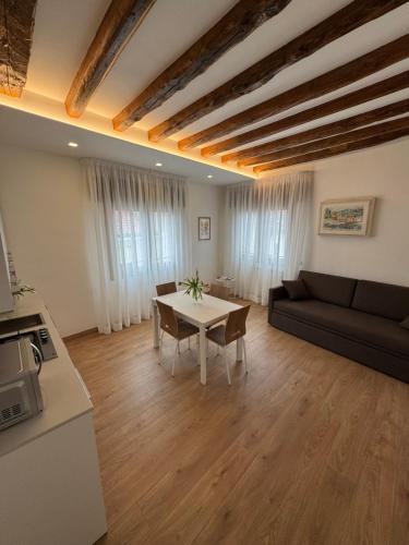 a living room with a couch and a table at Casa AnnaPaola Luxury in Chioggia