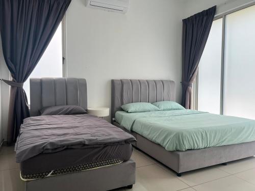 Katil atau katil-katil dalam bilik di Bungalow 16Pax Anjung Residensi