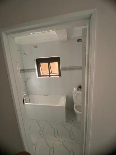 a bathroom with a sink and a toilet at Villa Prince in Harare