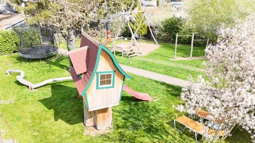 an overhead view of a play park with a toy house at Hotel Sunnegässle in Rust