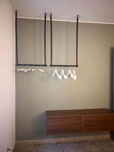 a room with a shelf with white cups and a table at Apartment Nicole in Menaggio