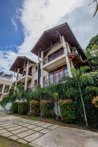 a building with a lot of plants in front of it at Akway Resort Beragala Haputale in Beragala