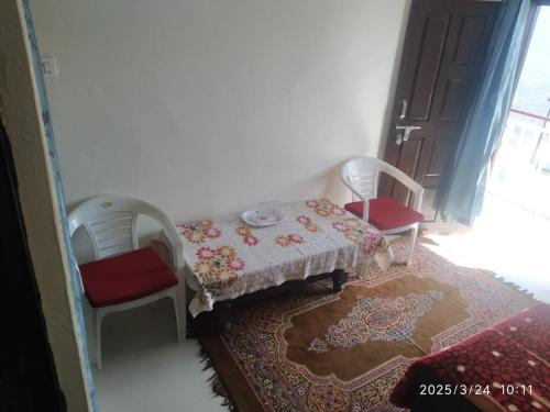 Ένα ή περισσότερα κρεβάτια σε δωμάτιο στο Shree Balaji Homestay