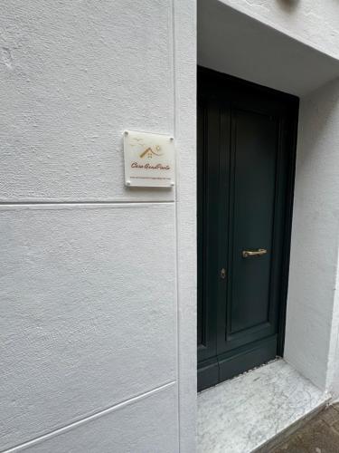 a door to a building with a sign on it at Casa AnnaPaola Luxury in Chioggia