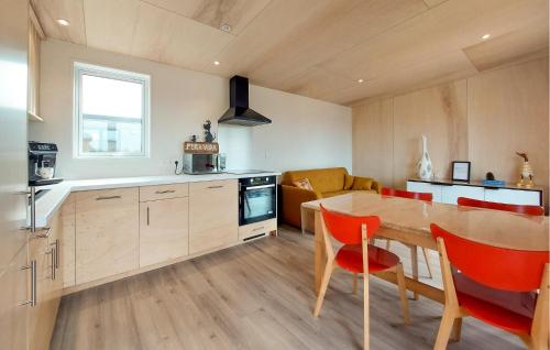 a kitchen and dining room with a table and chairs at 2 Bedroom Beautiful Home In Ambon in Ambon
