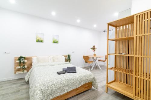 เตียงในห้องที่ Salatan Apartments, Plaza Paris