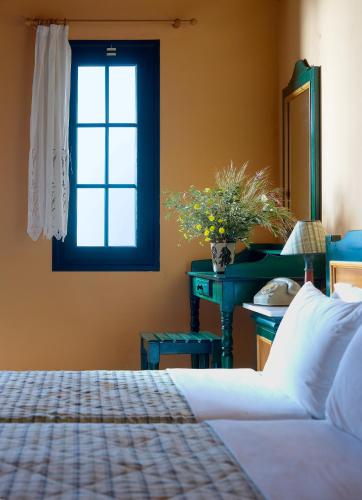 Ένα ή περισσότερα κρεβάτια σε δωμάτιο στο Hotel Ledra