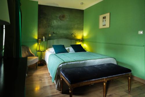 Un ou plusieurs lits dans un hébergement de l'établissement Hotel du Palais