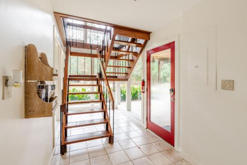 a room with a spiral staircase in a house at Glass House retreat on scenic Bogue Falaya river in Covington