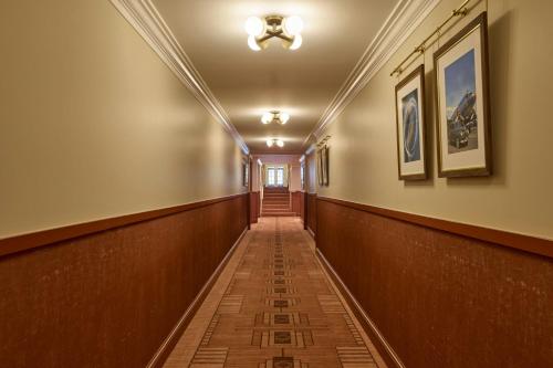 a corridor in a building with a long hallway at Dearborn Inn, Autograph Collection in Dearborn