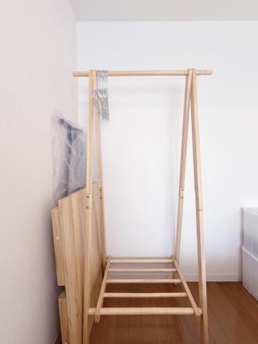 a wooden ladder leaning against a wall at The Inui N3 in Tokyo