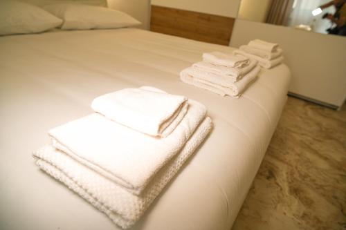 Ένα ή περισσότερα κρεβάτια σε δωμάτιο στο Luxury Rome by the Sea