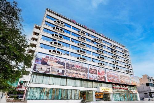 a building with a billboard on the side of it at Palette The Travellers Hotel Bangkok in Bangkok