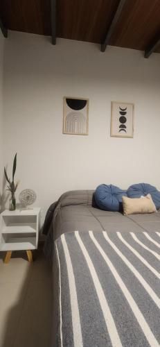 En eller flere senge i et værelse på Ubicación Perfecta