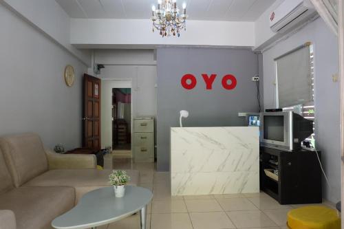 a living room with a couch and a table at OYO 75429 - 101 Place Navanakorn in Bangkok
