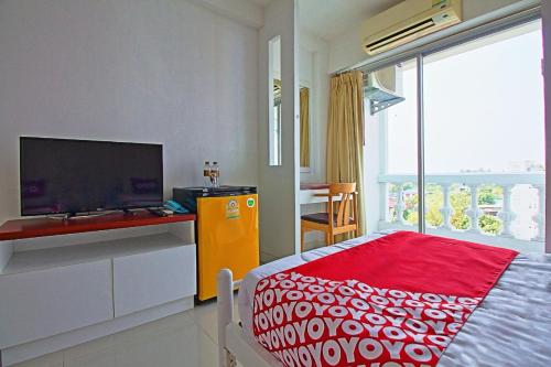 Postel nebo postele na pokoji v ubytování Super OYO 498 Ladawan Villa