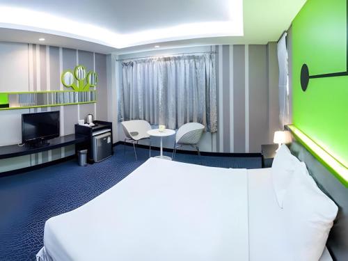 Postel nebo postele na pokoji v ubytování Marian Palazz Hotel