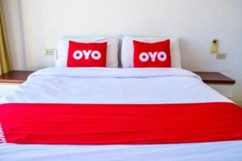 Postel nebo postele na pokoji v ubytování Super OYO 498 Ladawan Villa