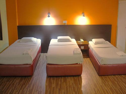Ένα ή περισσότερα κρεβάτια σε δωμάτιο στο Hotel O Hotel Ramai