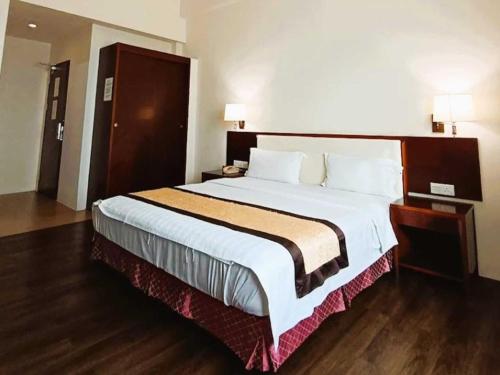Postel nebo postele na pokoji v ubytování OYO 91037 Atari Inn