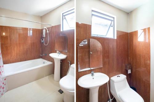 a bathroom with a sink and a toilet and a tub at OYO 195 Ranchotel - Biñan in Biñan