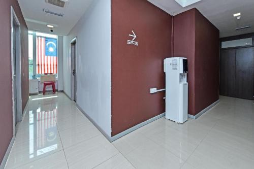 an empty hallway with a refrigerator in a building at Hotel O Fajar Baru Boutique Hotel in Kuala Terengganu