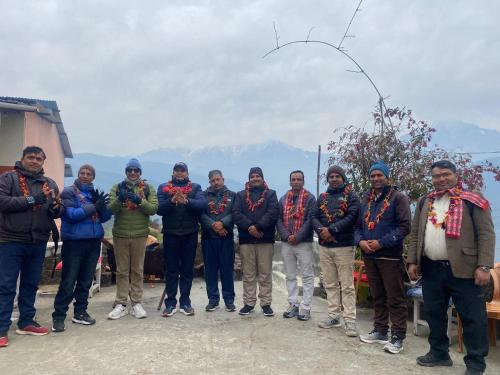 a group of people are posing for a picture at Anne Homestay in Pokhara