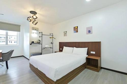 Una cama o camas en una habitación de Padi Hotel Alor Setar