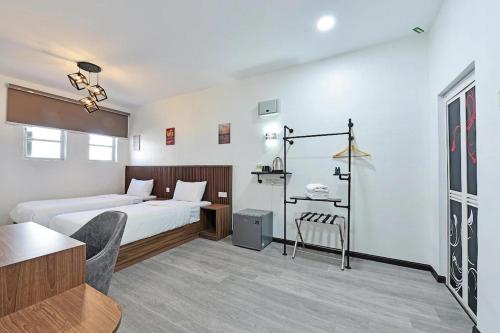 Una cama o camas en una habitación de Padi Hotel Alor Setar