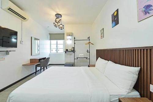 Una cama o camas en una habitación de Padi Hotel Alor Setar