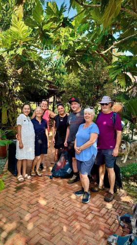 a group of people posing for a picture at Song Ngư Riverside Homestay in Can Tho