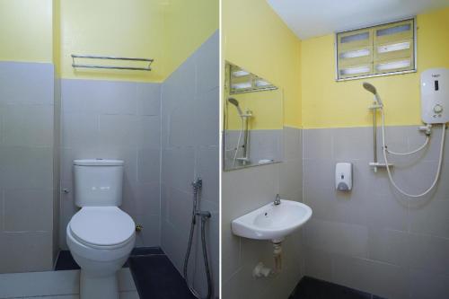 a bathroom with a toilet and a sink at Hotel O Bangi Sri Minang Guesthouse in Bangi