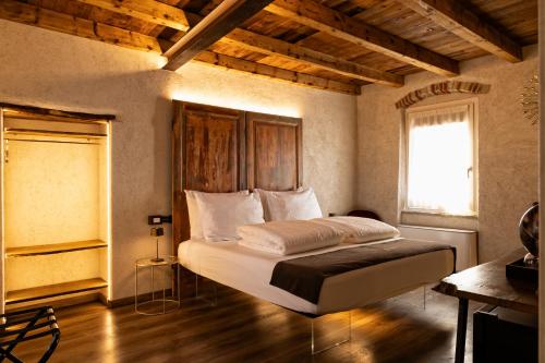 Postel nebo postele na pokoji v ubytování Domus Mea Suites