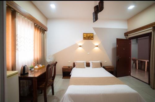 Krevet ili kreveti u jedinici u okviru objekta Central Hotel