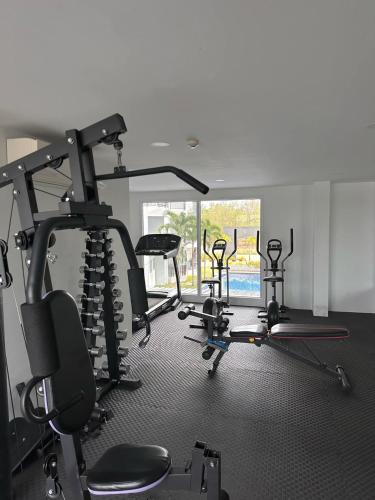 a gym with several exercise bikes in a room at BEACH Condo Mae Phim in Ban Tha Fat