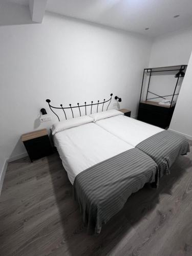 Postel nebo postele na pokoji v ubytování Hostal Mónaco