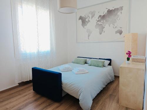 a bedroom with a bed with a map on the wall at Free Parking - No Tourist Tax - Motor Valley in Castelfranco Emilia