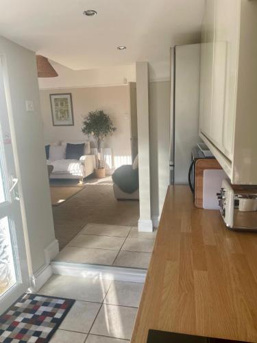 a living room with a couch and a table at 2025 Traveller award winner Just bring clothes in West Kirby