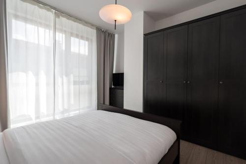 Postel nebo postele na pokoji v ubytování Class Residence Two - 2BR Suite