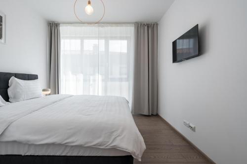 Postel nebo postele na pokoji v ubytování Class Residence Two - 2BR Suite