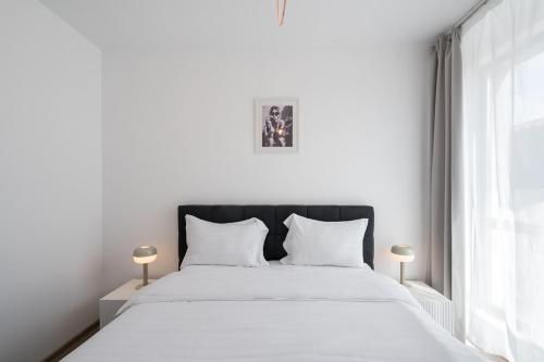 Postel nebo postele na pokoji v ubytování Class Residence Two - 2BR Suite