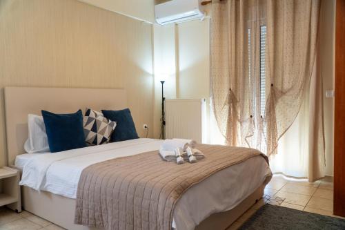 Ένα ή περισσότερα κρεβάτια σε δωμάτιο στο Stergios_Apartments 04