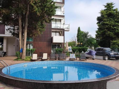 a large swimming pool in front of a building at Amara Butik on the first line in Ravda