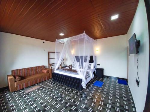 a living room with a couch and a hammock at Ella Happy View Homestay in Ella