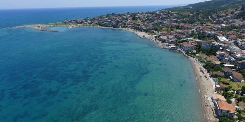 an aerial view of a beach and the ocean at Evi's Seafront Hideaway - Petalidi Cozy Nest in Petalidhion