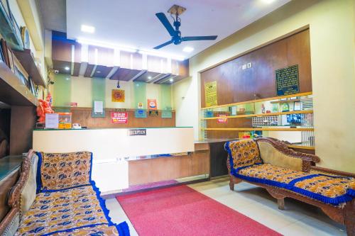 a waiting room with two chairs in a store at Mahadev Regency Hotel in Jaipur