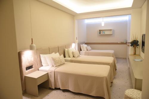 Postel nebo postele na pokoji v ubytování Mozaik Hotel