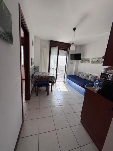 a living room with a couch and a table at AMA cityhouse in Novara